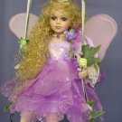 Fabulous Fairy Doll on Swing dressed in Purple