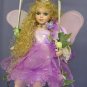 Fabulous Fairy Doll on Swing dressed in Purple