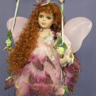 Fairy Doll on Swing Dressed in Plum