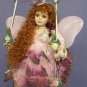 Fairy Doll on Swing Dressed in Plum