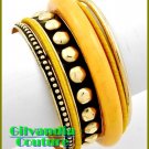 Boutique bracelet highlights your wardrobe with colorful theme and fine metalwork.