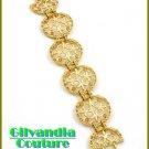A fabulous boutique bracelet broadcasting topaz rhinestones and Fleur De Lis motif.