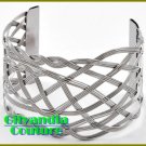 This couture boutique bracelet flaunts a rhodium cultivated finish and fine metal work.