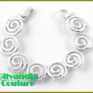 A fashion bracelet with silvertone finish and Everlasting circle design .