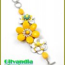 A wonderful yellow boutique bracelet that is full of sensational acrylic and epoxy flowers.