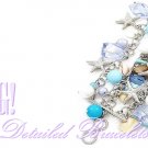 This fabulous fashion bracelet delivers a breezy feel with acrylics nautical charms.