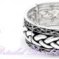 Fashion bracelet is detailed with filigree mesh metalwork and drenched in silvermode finishing.