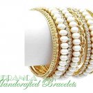 Stackable with 10 rows of satin cream pearls and metalwork.  JONFRANCA fashion bracelet.