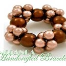 Stretch cluster pearls in a bronze shade. JONFRANCA Fine fashion bracelet.