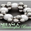 Stretch cluster pearls in sliver and white shades. JONFRANCA Fine fashion bracelet.