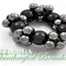JONFRANCA Fine fashion bracelet. Stretch cluster pearls insmoke and grey shades.