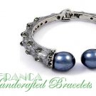 JONFRANCA Fine fashion bracelet. Grand pearls and ice rhinestone accents with grey swirls.