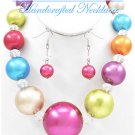 JONFRANCA CIAGA's fashion necklace with bold acrylic pearls in candy store colors.