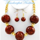 JONFRANCA CIAGA's Hampton Hills® fashion necklace with ceramic balls in a deep red mix.