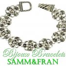 Boutique look, fashion bracelet of beautiful silvertone metalwork with a fabulous flower motif.