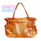 Posh!...Couture designed orange two-tone celebrity handbag by AFFIRMATION on sale now.