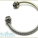 MEDIA ATTENTION boutique fashion bracelet, with clear ice crystals and twisted cable metalwork.