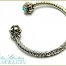 MEDIA ATTENTION boutique fashion bracelet, with blue crystals and twisted cable metalwork.