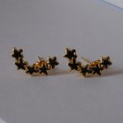 Black Star earrings with golden colour edge