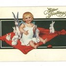 EASTER GREETINGS GIRL ON BLANKET WITH RABBITS  POSTCARD