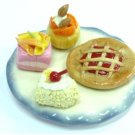 Mini Cake and tart on White and blue plate NBR99