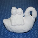 BRIDE AND GROOM ON SWAN