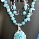 AquaMarine Necklace with Sterling Silver wrapped dyed Quartz pendant.