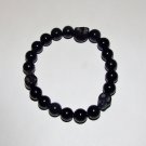 Men's 10 MM Black Onyx Stretch Bracelet With Howlite Skulls 8.0"