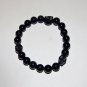 Men's 10 MM Black Onyx Stretch Bracelet With Howlite Skulls 8.0"