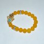 Light Orange 10 MM Jade Hamsa Stretch Bracelet 7.25"