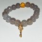 Women's 10 MM Faceted Gray Agate Golden Key Stretch Bracelet 7.10" #225