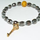 Women's 9 MM Silver Czech Glass Barrel Bead Golden Key Stretch Bracelet 7.10"  #258
