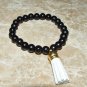Women's 8 MM Black Onyx Suede Tassel Stretch Bracelet 7.25"