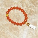 Women's 10 MM Orange Carnelian Mala Tassel Stretch Bracelet 7.25"