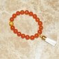 Women's 10 MM Orange Carnelian Mala Tassel Stretch Bracelet 7.25"