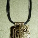 PEWTER AND ENAMEL BLACK AND GOLD PENDANT NECKLACE