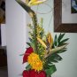 AN ELEGANT TROPICAL  SUNBURST  FLORAL ARRANGEMENT