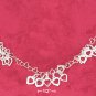 HEART LINK NECKLACE W/ CLUSTERS OF OPEN HEARTS