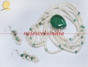 Magnificent pearl & emerald gemstone with silver string