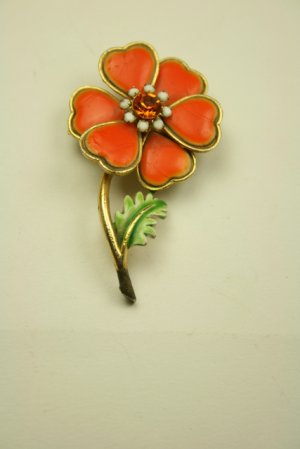 Fun bright orange Vintage pin with orange rhinestone center