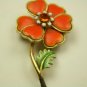 Fun bright orange Vintage pin with orange rhinestone center