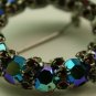 Vintage Aurora Borealis Ruby Wreath style pin, signed Warner