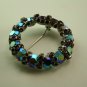 Vintage Aurora Borealis Ruby Wreath style pin, signed Warner