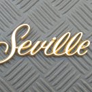 OEM Cadillac Seville Body/Dash Emblem. Rare GOLD color!