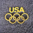 OEM GOLD USA Olympics Edition Body/Dash Emblem. Yellow Color.