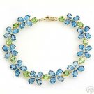 DD-1599Y: 14K. GOLD TENNIS BRACELET W/NR . BLUE TOPAZ & PERIDOTS