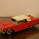 Red Metal car / T-Bird?