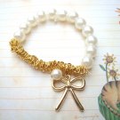 Bracelet with Faux Pearl and Gold Ribbon Charm B257