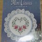 ROSES FROM DESIGNS OF THE NEEDLE WITH HOOP-NIP
