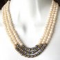 THREE STRAND PEARL NECKLACE WITH BLACK PEARLS AND GOLD ACCENTS